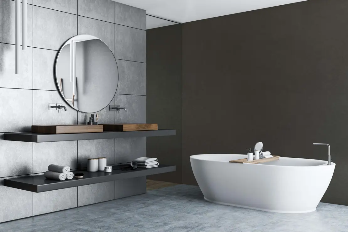 Baño con paredes de microcemento de color gris intenso
